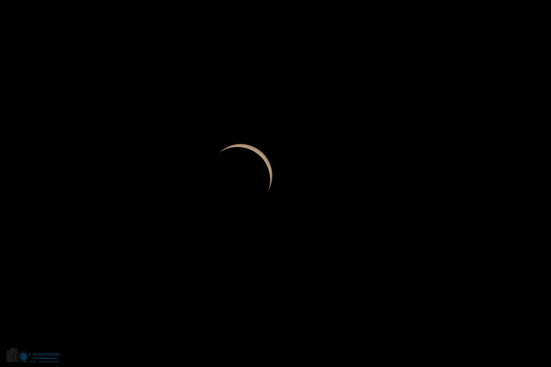 Last Crescent - Sun continues to come out of total coverage by moon. by 4 Hemispheres Photography